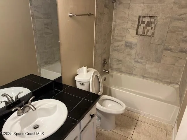 a bathroom with a toilet a sink and bathtub