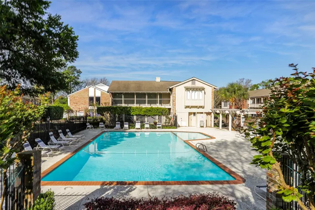a view of houses with yard and outdoor seating