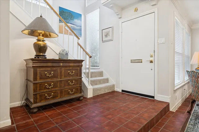 a view of a livingroom with furniture and an entryway