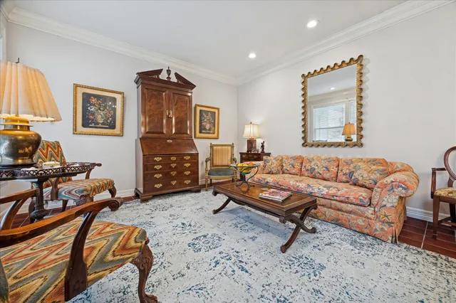 a living room with furniture a rug and a window