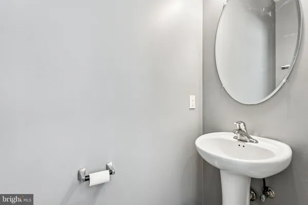 a bathroom with a sink a mirror and vanity