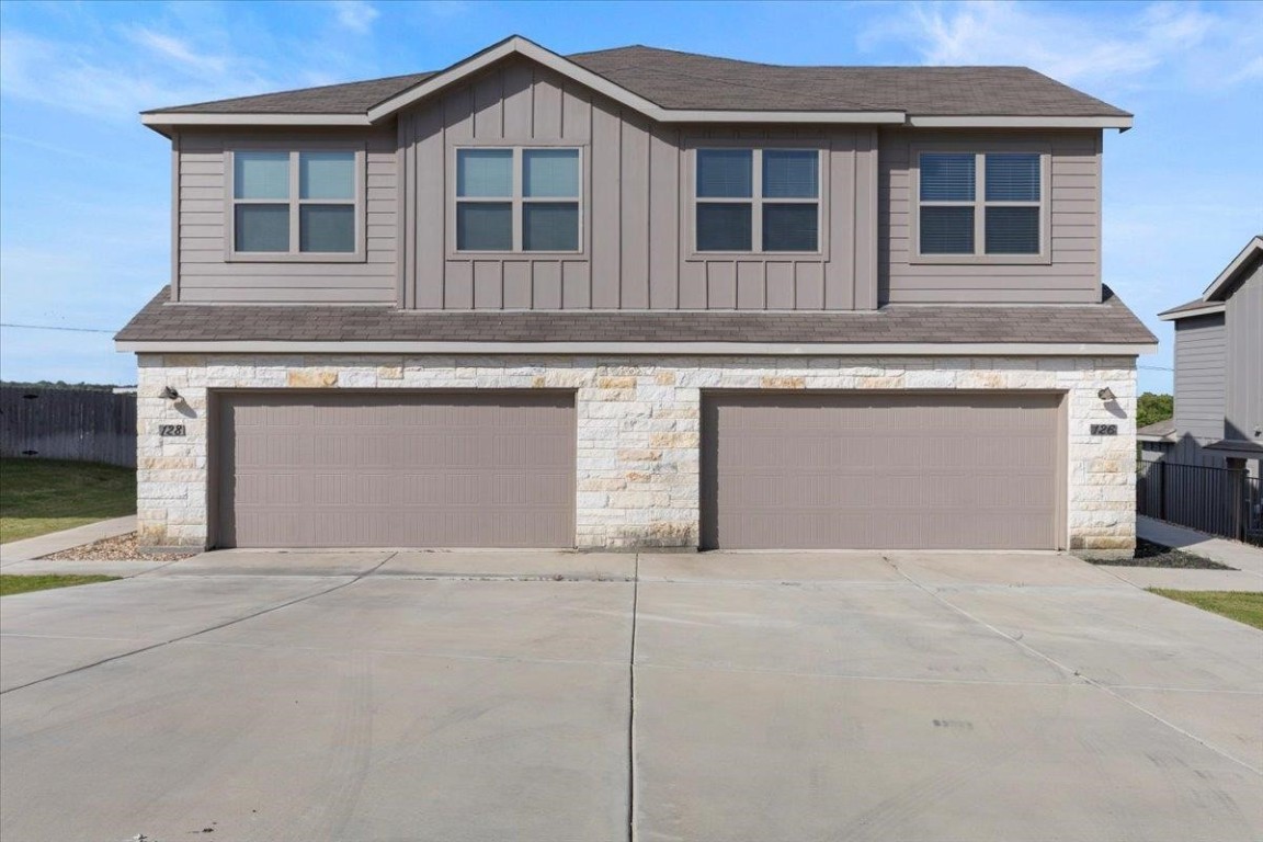 126 Dodge Road Georgetown, TX 78626 - Photo 1 of 18 a front view of a house with a garage