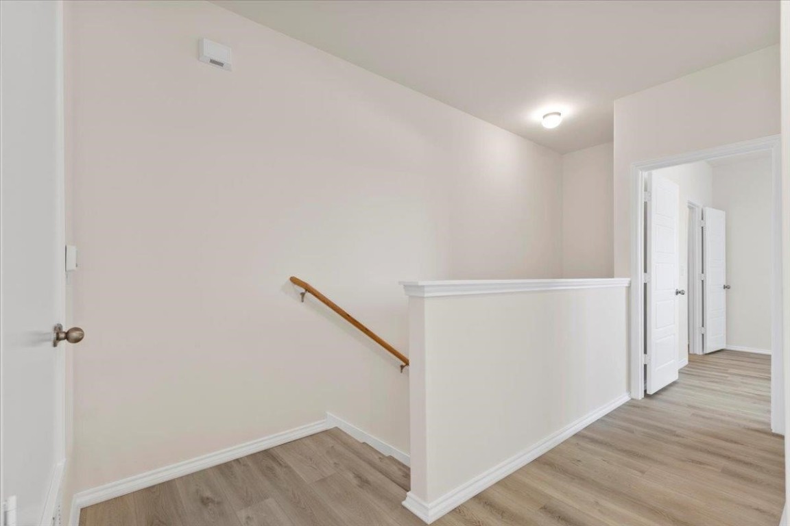 126 Dodge Road Georgetown, TX 78626 - Photo 9 of 18 a view of a hallway with wooden floor and entryway