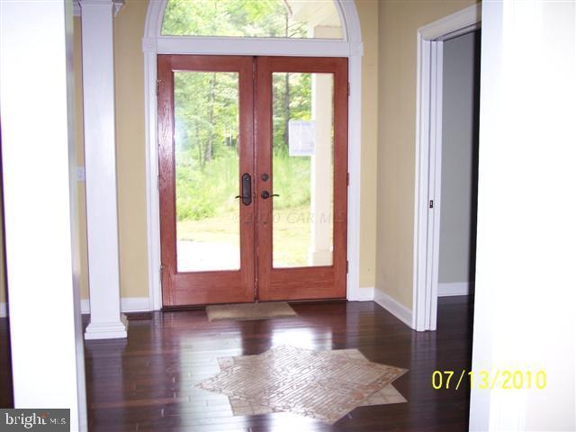 9514 Croppers Island Road Newark, MD 21841 - Photo 3 of 9 a view of an entryway with wooden floor