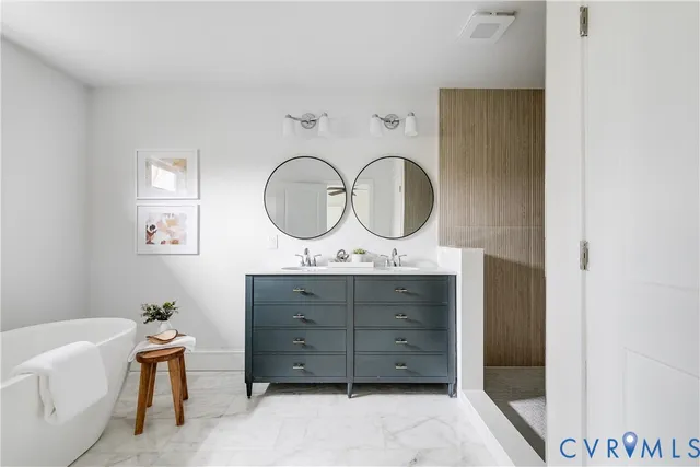 a view of two mirror and a dresser