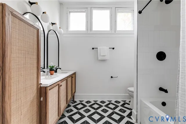 a bathroom with a sink a mirror and a shower