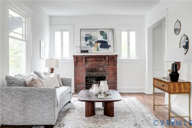 a living room with furniture and a fireplace