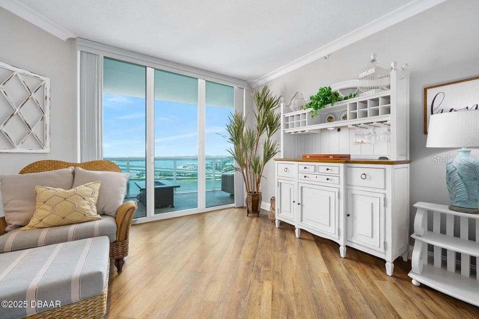 231 Riverside Drive, Unit 15071 Daytona Beach, FL 32117 - Photo 11 of 53 a living room with furniture and wooden floor