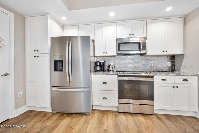 a living room with furniture a rug and a window
