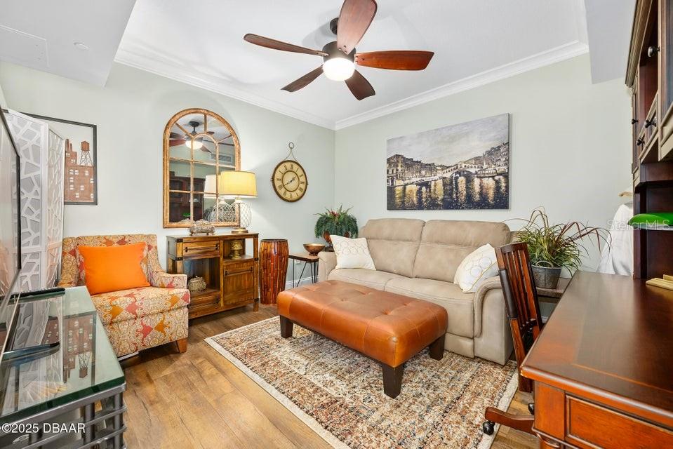 231 Riverside Drive, Unit 15071 Daytona Beach, FL 32117 - Photo 18 of 53 a living room with furniture a rug and a window