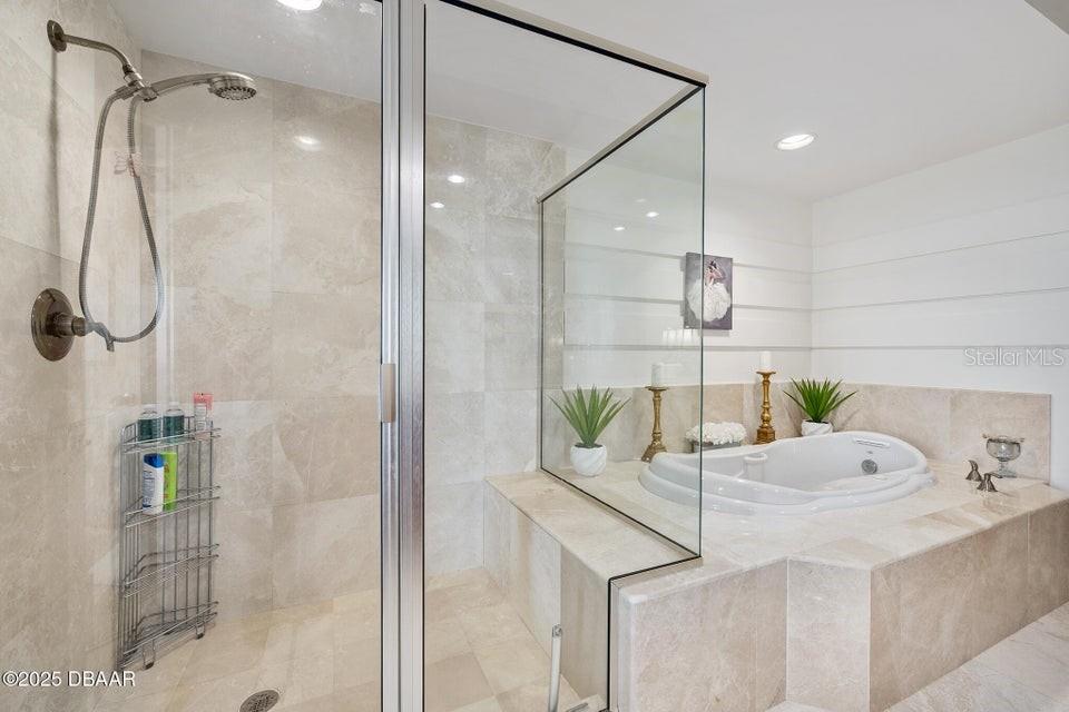 231 Riverside Drive, Unit 15071 Daytona Beach, FL 32117 - Photo 27 of 53 a bathroom with a shower and sink