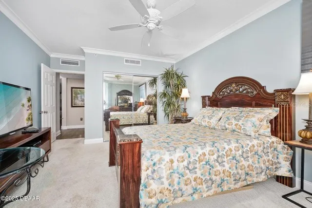 a bed room with furniture and a chandelier