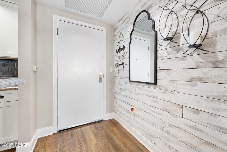 231 Riverside Drive, Unit 15071 Daytona Beach, FL 32117 - Photo 3 of 53 a view of a closet with wooden floor