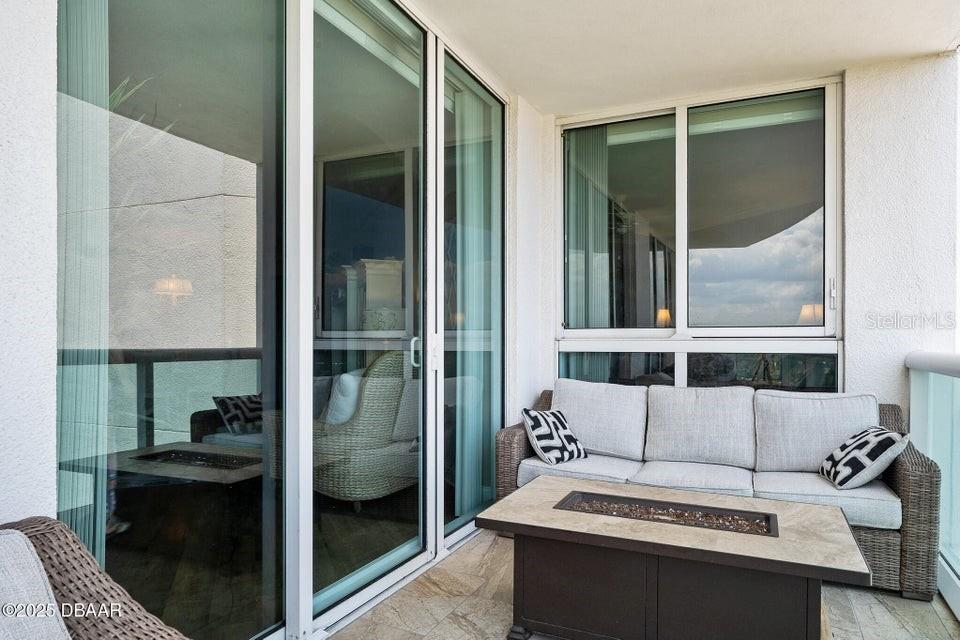 231 Riverside Drive, Unit 15071 Daytona Beach, FL 32117 - Photo 32 of 53 a kitchen with a sink and a refrigerator