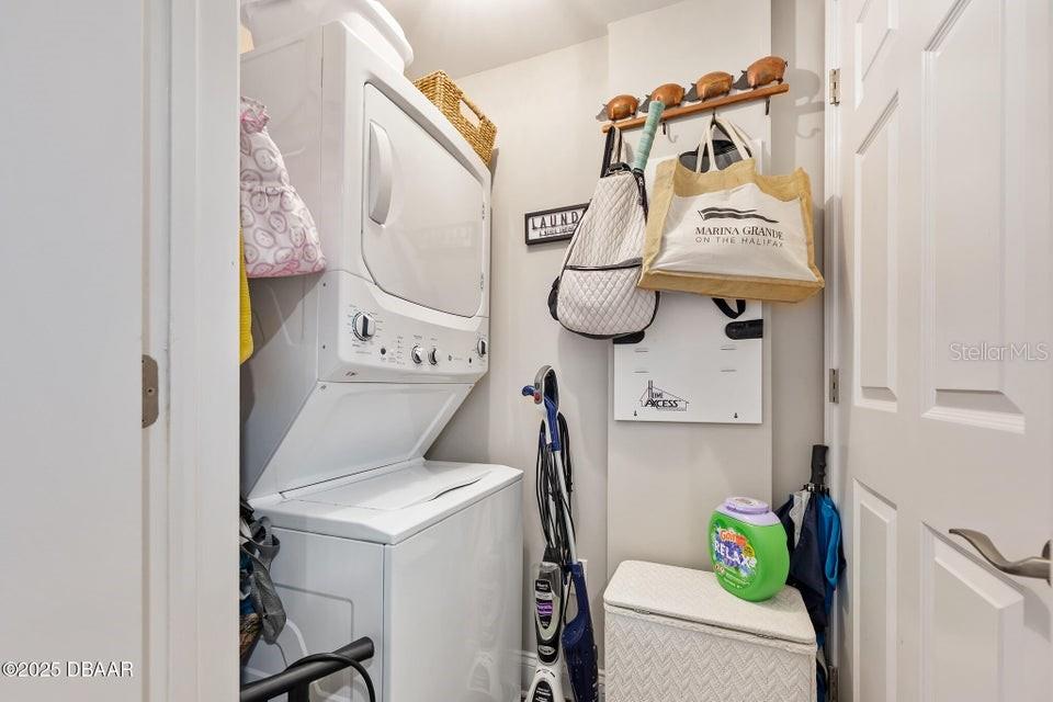 231 Riverside Drive, Unit 15071 Daytona Beach, FL 32117 - Photo 34 of 53 a utility room with dryer and washer