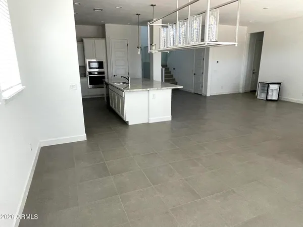 a view of a kitchen with refrigerator and microwave