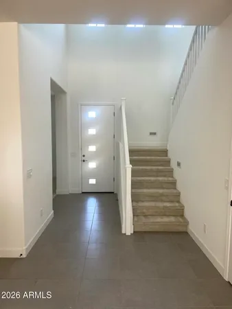 a view of a hallway with staircase