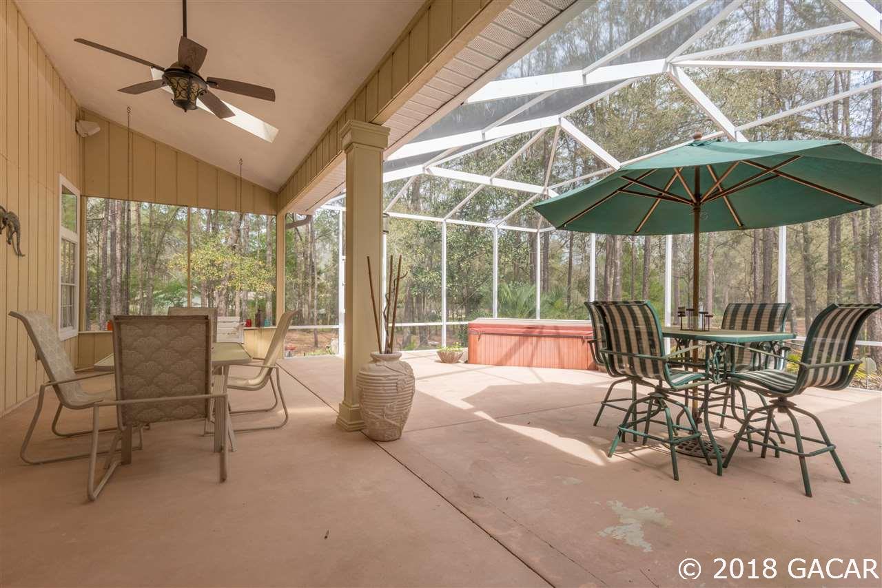 10107 Southwest 75th Way Gainesville, FL 32608 - Photo 19 of 23 Screened Lanai with Hot Tub