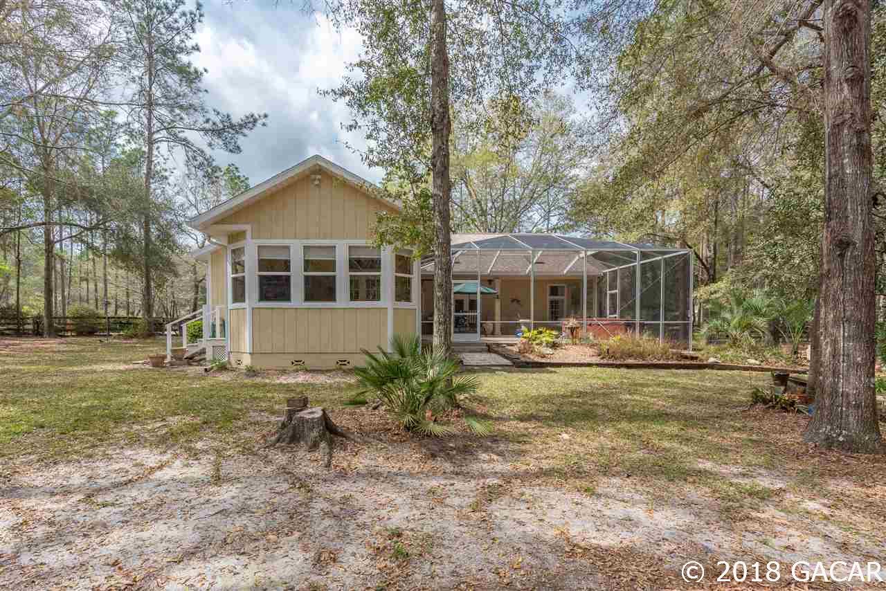 10107 Southwest 75th Way Gainesville, FL 32608 - Photo 21 of 23 Rear Elevation viewed from Backyard