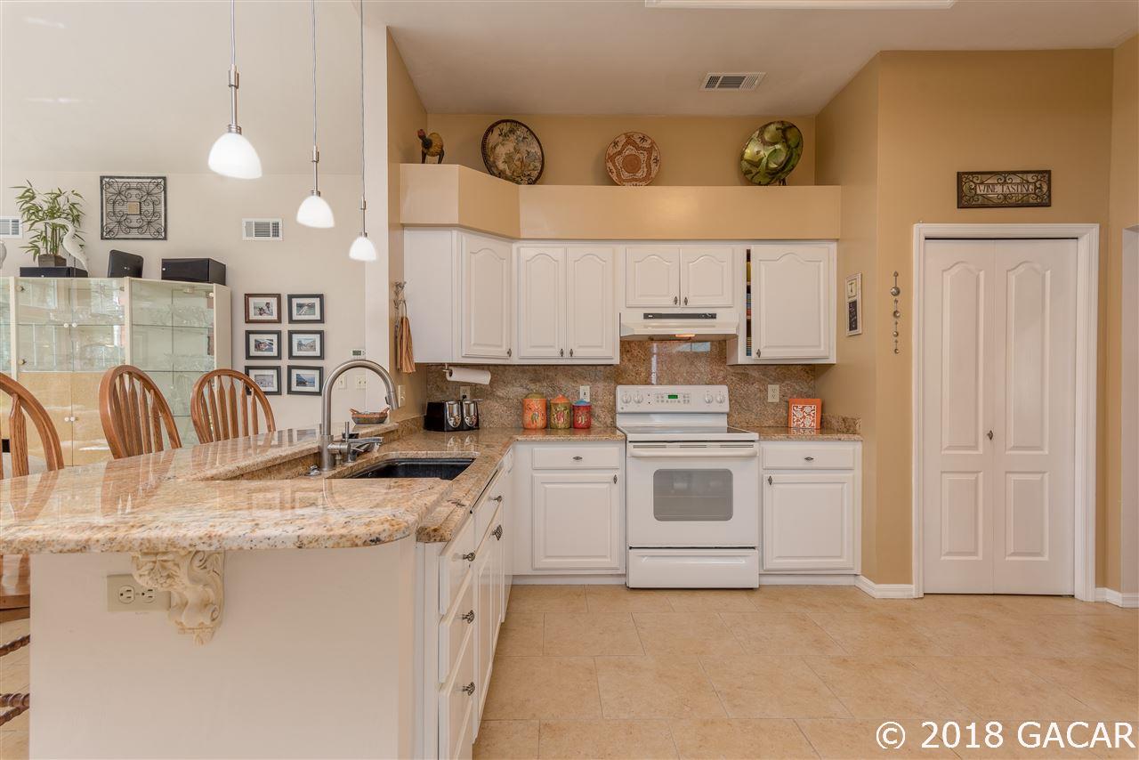 10107 Southwest 75th Way Gainesville, FL 32608 - Photo 9 of 23 Kitchen looking towards front of home