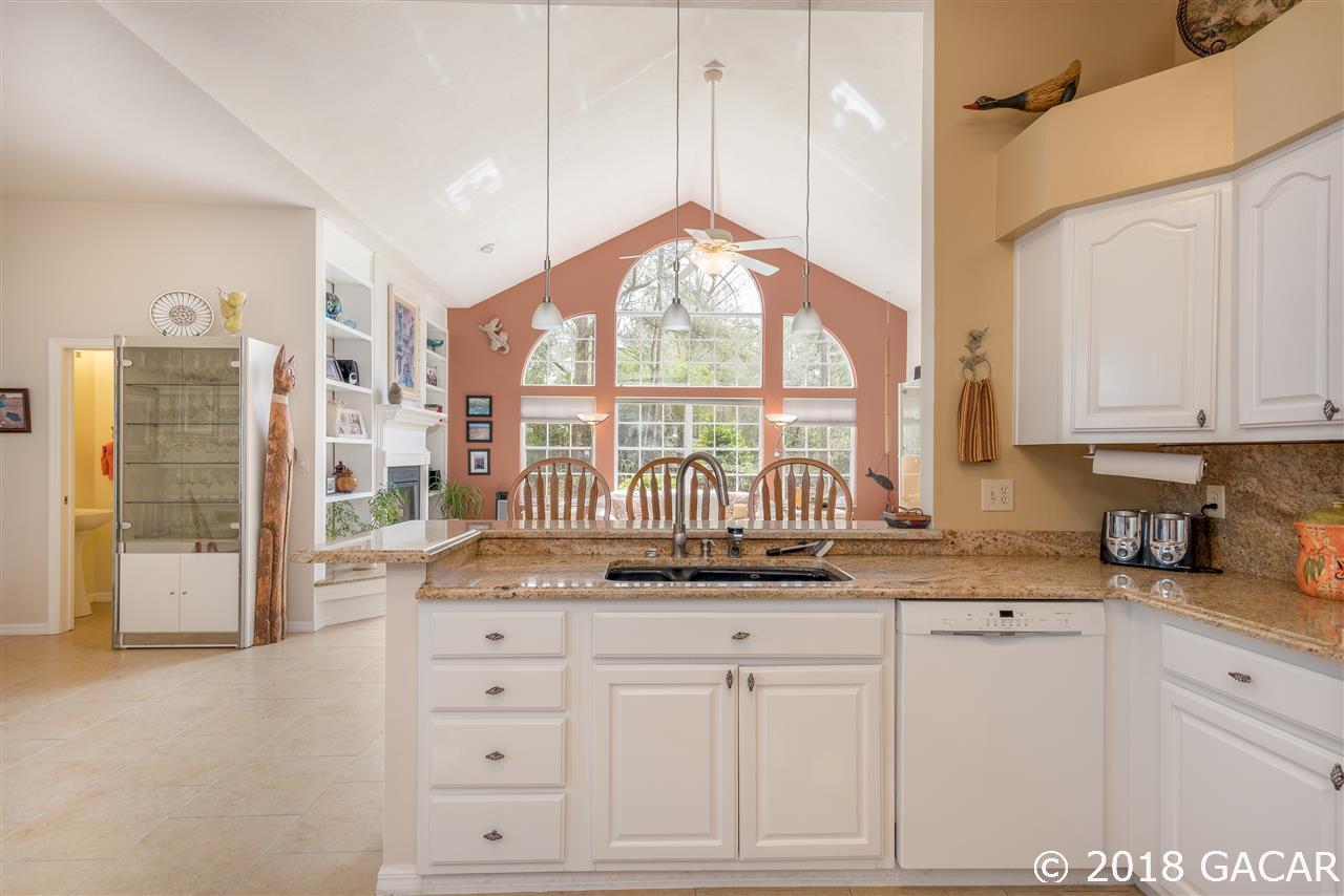 10107 Southwest 75th Way Gainesville, FL 32608 - Photo 10 of 23 Kitchen looking out over Family Room