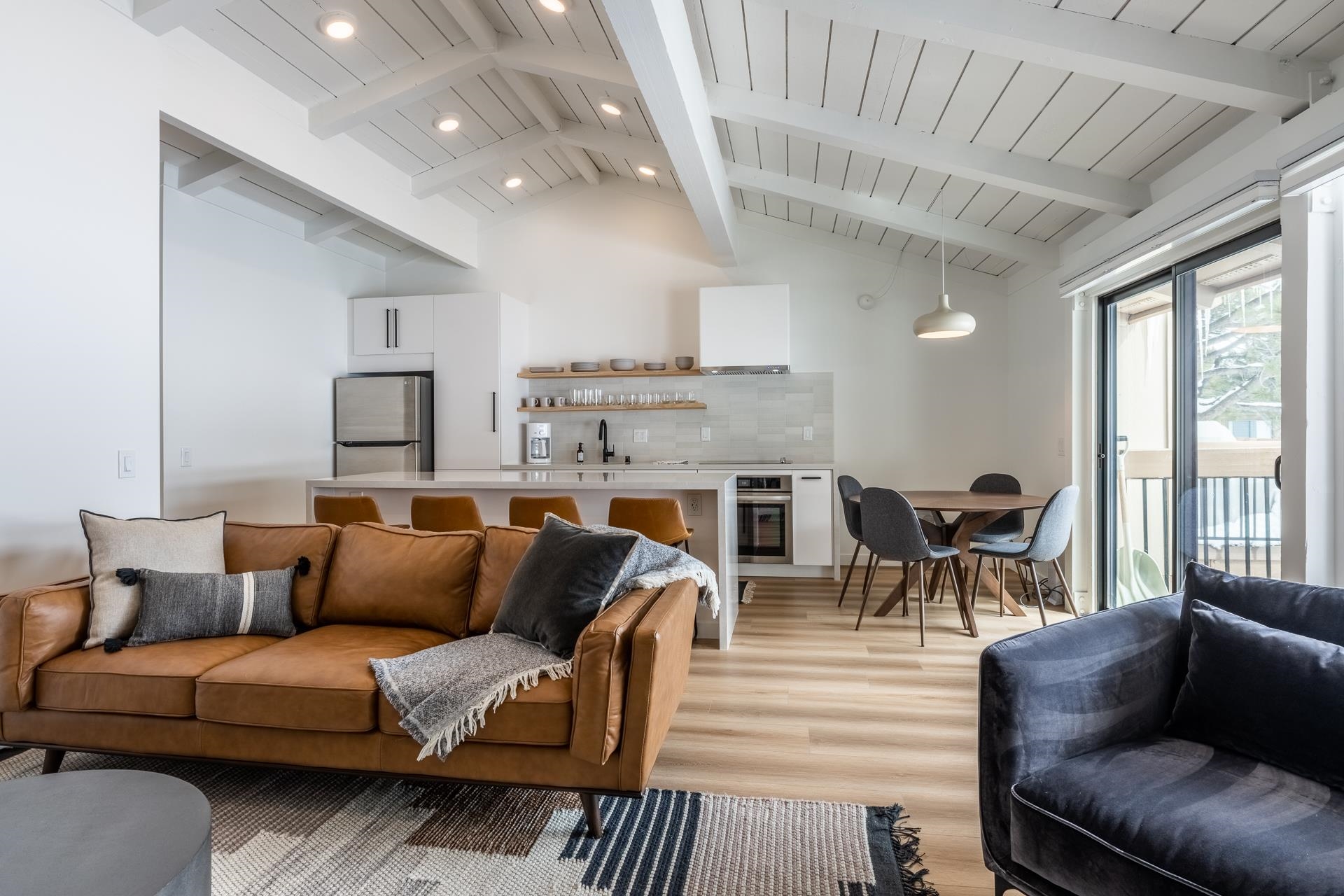 3252 Chateau Road, Unit 22 Mammoth Lakes, CA 93546 - Photo 1 of 46 Vaulted ceiling with exposed white beams and recessed lighting