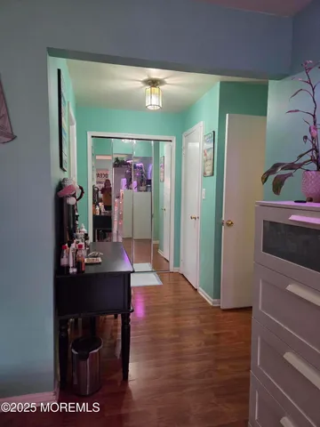 a bedroom with a bed a couch and dresser