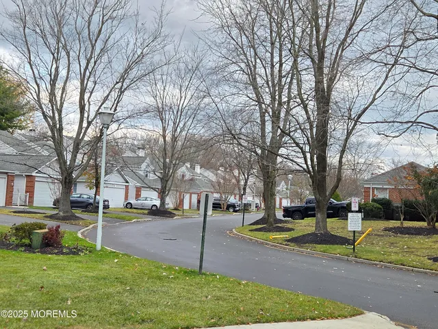 a view of a house with backyard and entertaining space