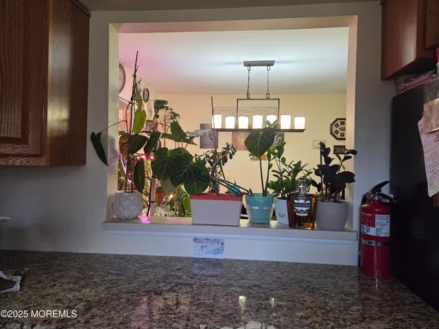 a kitchen with a table and chairs in it