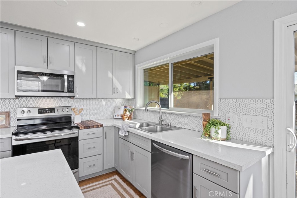 1 Parkhurst Street Chico, CA 95928 - Photo 13 of 52 a kitchen with a sink stove and microwave