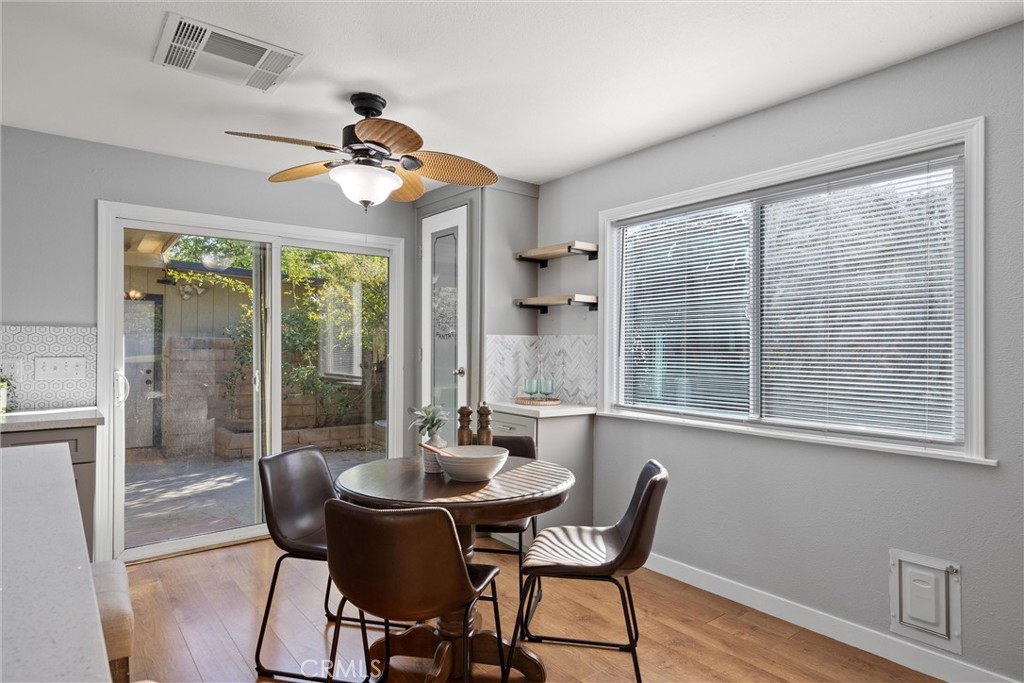 1 Parkhurst Street Chico, CA 95928 - Photo 15 of 52 a dining room with furniture a chandelier and wooden floor