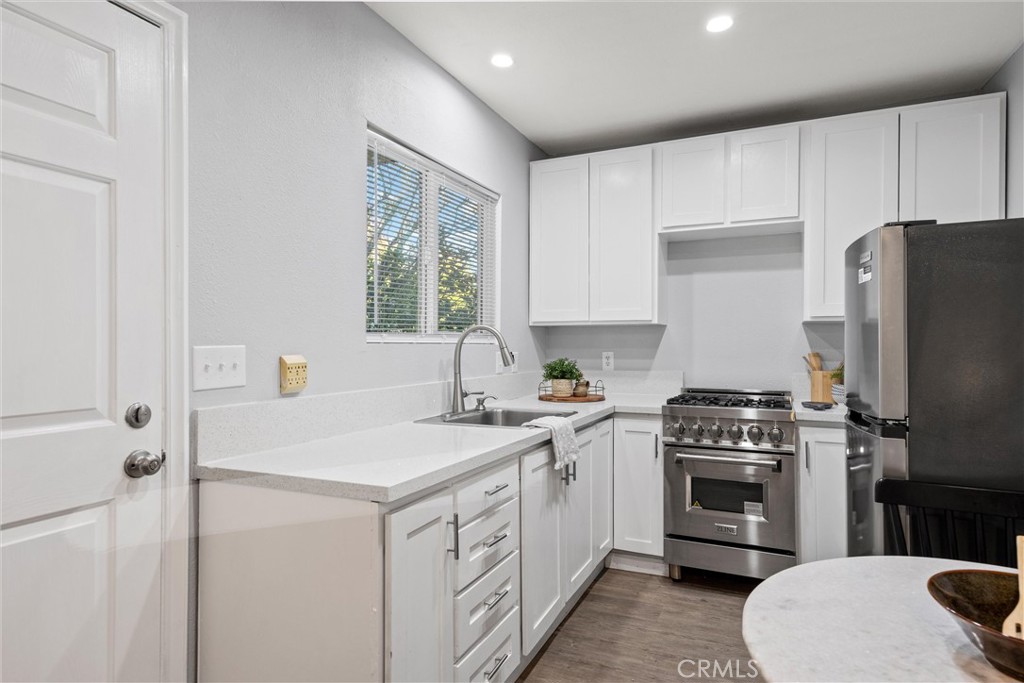 1 Parkhurst Street Chico, CA 95928 - Photo 28 of 52 a kitchen with a sink stove and refrigerator
