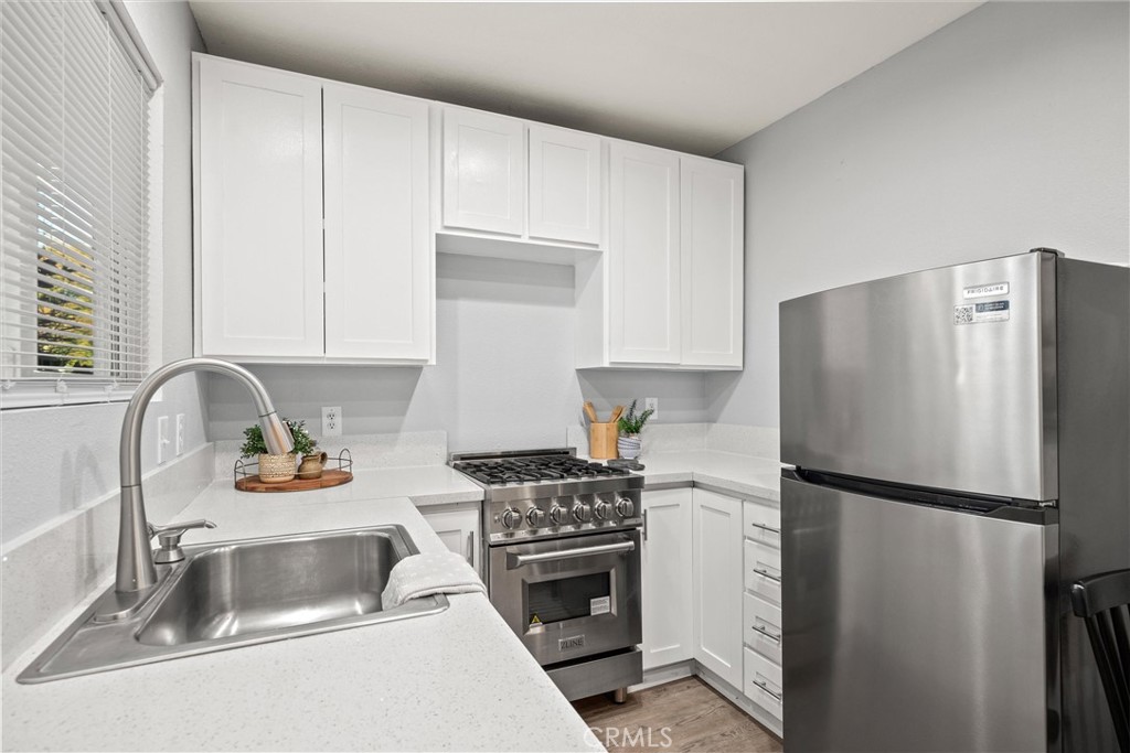 1 Parkhurst Street Chico, CA 95928 - Photo 30 of 52 a kitchen with a refrigerator sink and cabinets