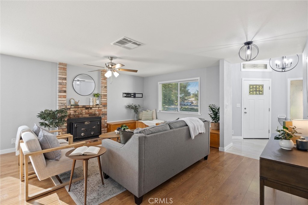 1 Parkhurst Street Chico, CA 95928 - Photo 3 of 52 a living room with furniture a chandelier and a window
