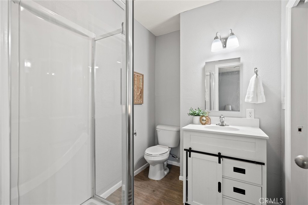 1 Parkhurst Street Chico, CA 95928 - Photo 33 of 52 a bathroom with a sink a toilet and a mirror