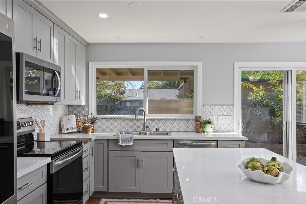 1 Parkhurst Street Chico, CA 95928 - Photo 8 of 52 a kitchen with stainless steel appliances a stove a sink and a counter space