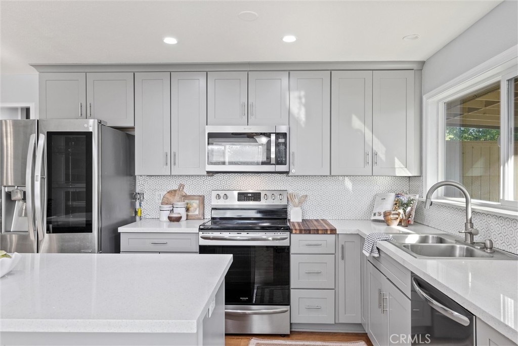 1 Parkhurst Street Chico, CA 95928 - Photo 10 of 52 a kitchen with a sink stove and refrigerator