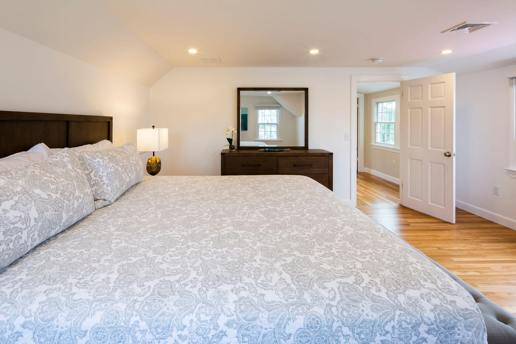 20 Hardings Beach Road Chatham, MA 02633 - Photo 12 of 20 a bedroom with a large bed and wooden floor