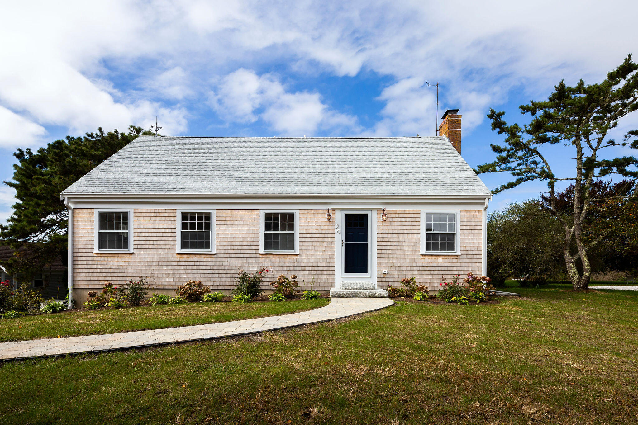 20 Hardings Beach Road Chatham, MA 02633 - Photo 2 of 20 a front view of a house with a yard