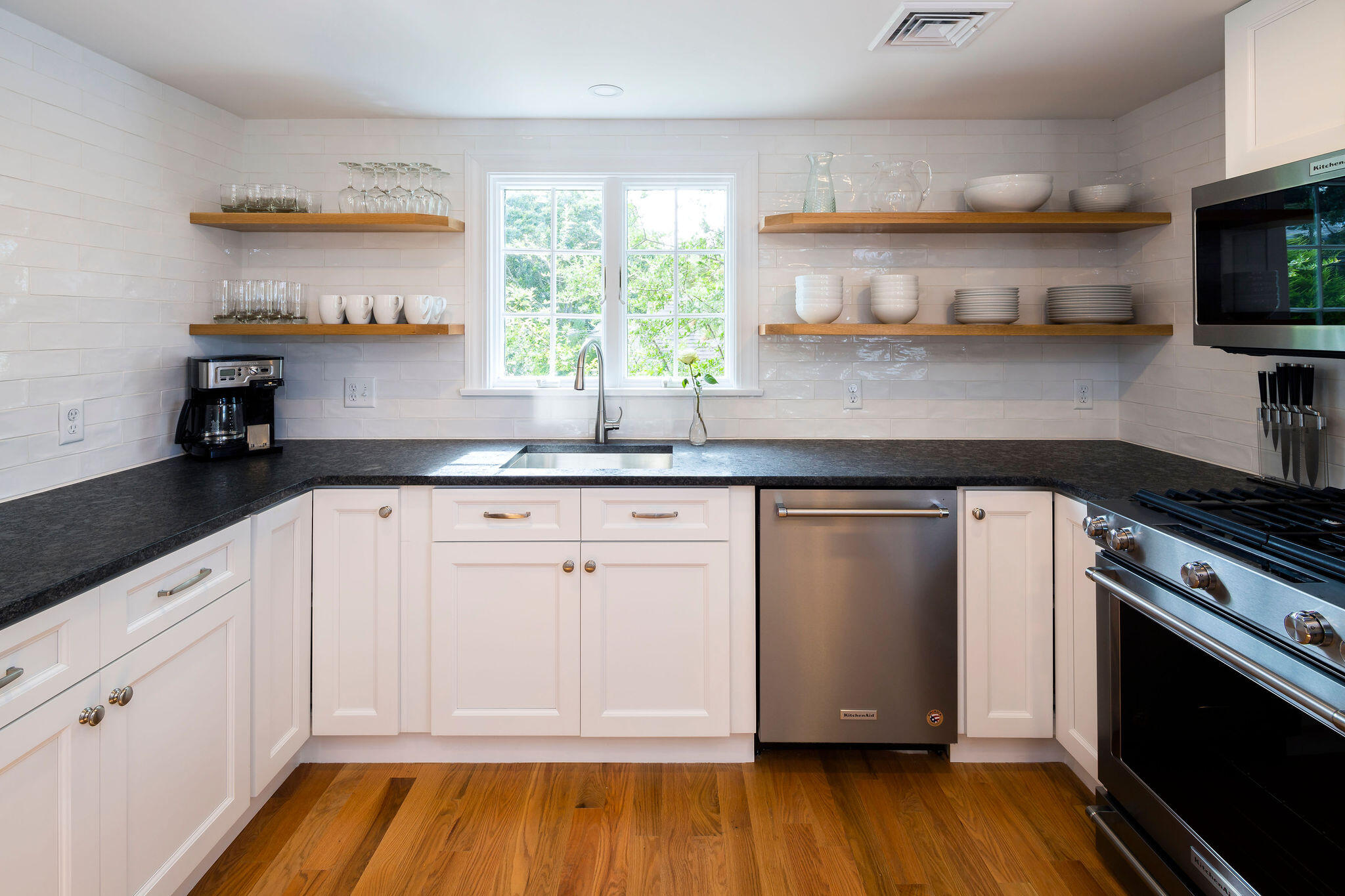 20 Hardings Beach Road Chatham, MA 02633 - Photo 5 of 20 a kitchen with stainless steel appliances granite countertop a sink and a stove top oven