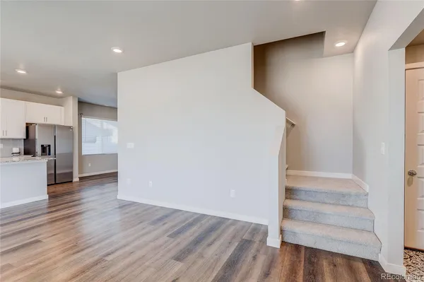 a view of kitchen and wooden floor