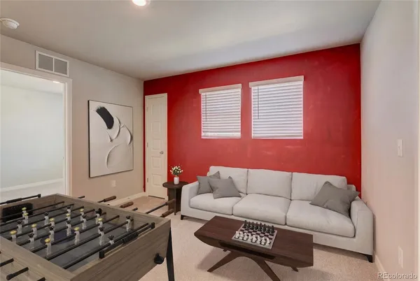 a living room with furniture and a window