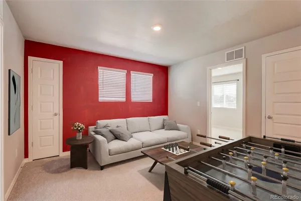 a living room with furniture and a window