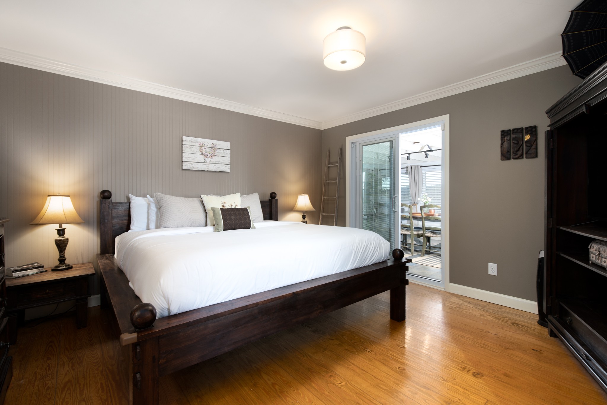 7515 Pewitt Road Franklin, TN 37064 - Photo 29 of 96 a bedroom with a bed and a flat tv screen on a dresser