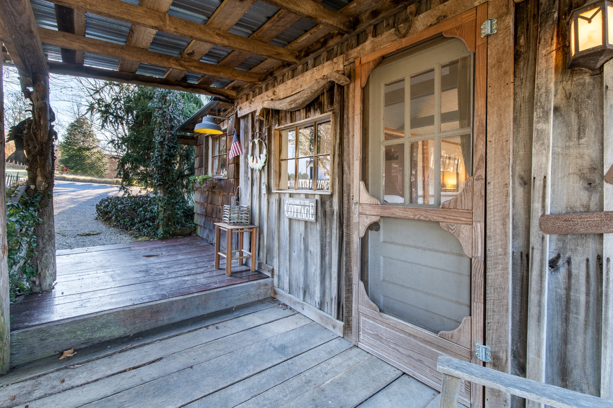 7515 Pewitt Road Franklin, TN 37064 - Photo 62 of 96 a view of a porch with wooden floor and outer view