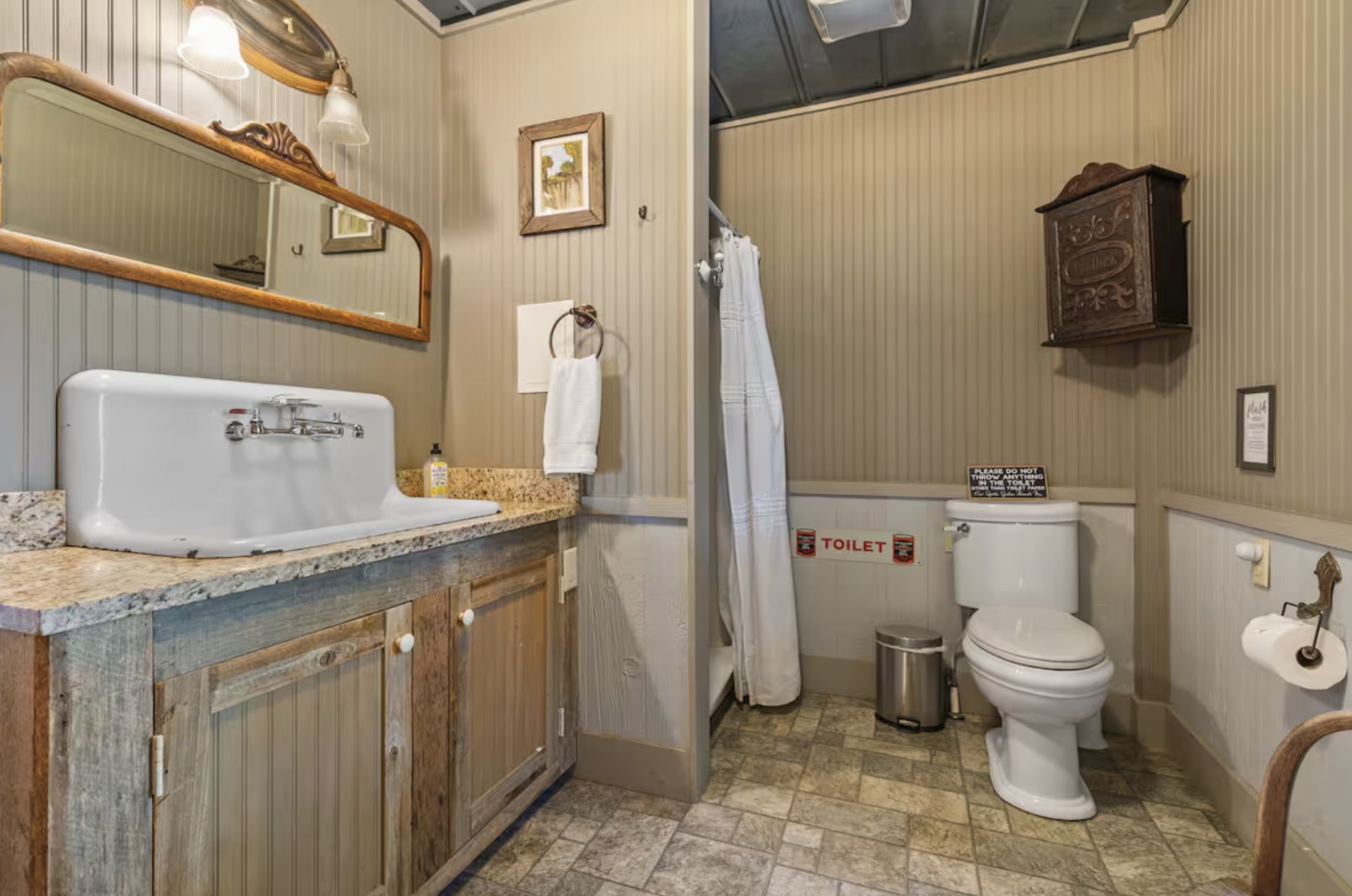 7515 Pewitt Road Franklin, TN 37064 - Photo 85 of 96 a bathroom with a granite countertop toilet sink and mirror