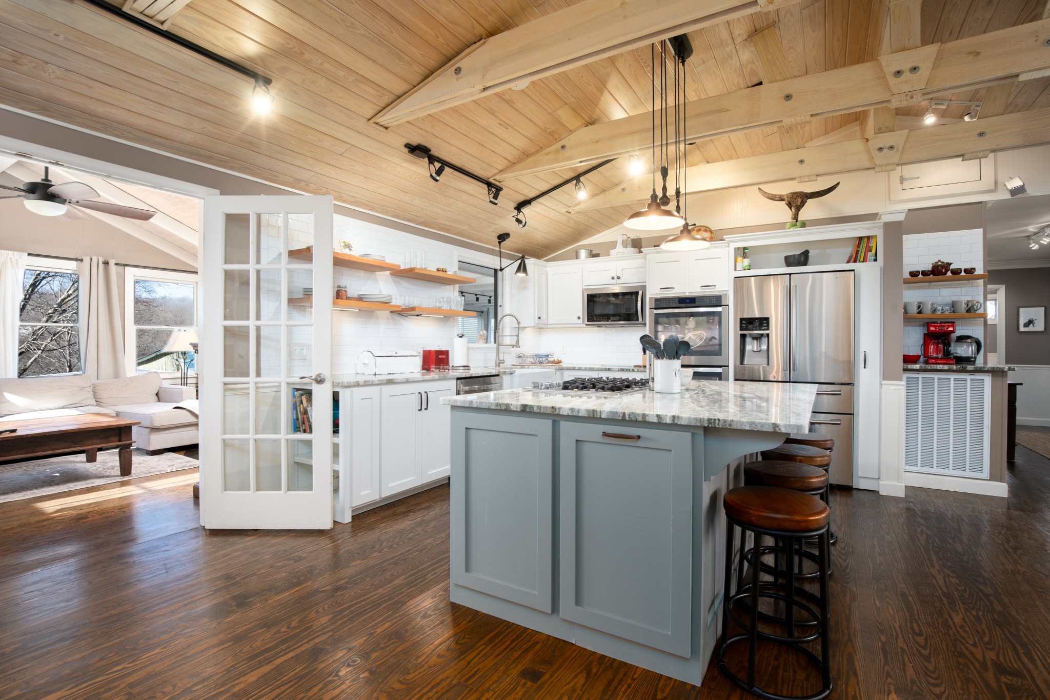 7515 Pewitt Road Franklin, TN 37064 - Photo 10 of 96 a kitchen with stainless steel appliances granite countertop a white cabinets and wooden floor