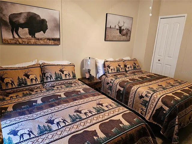 a bedroom with a bed and a tv in it