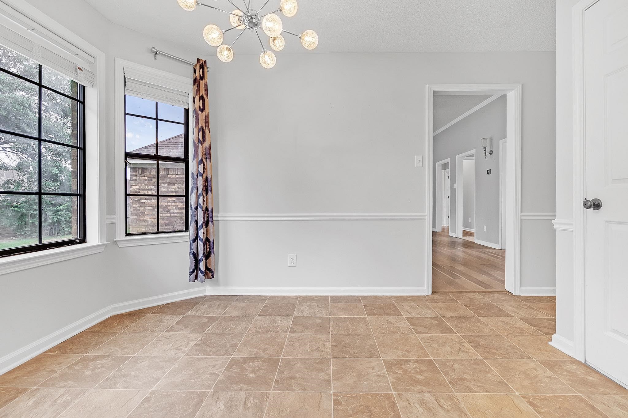 4788 Shadow View Lane Bartlett, TN 38002 - Photo 17 of 33 Unfurnished room with a chandelier and baseboards