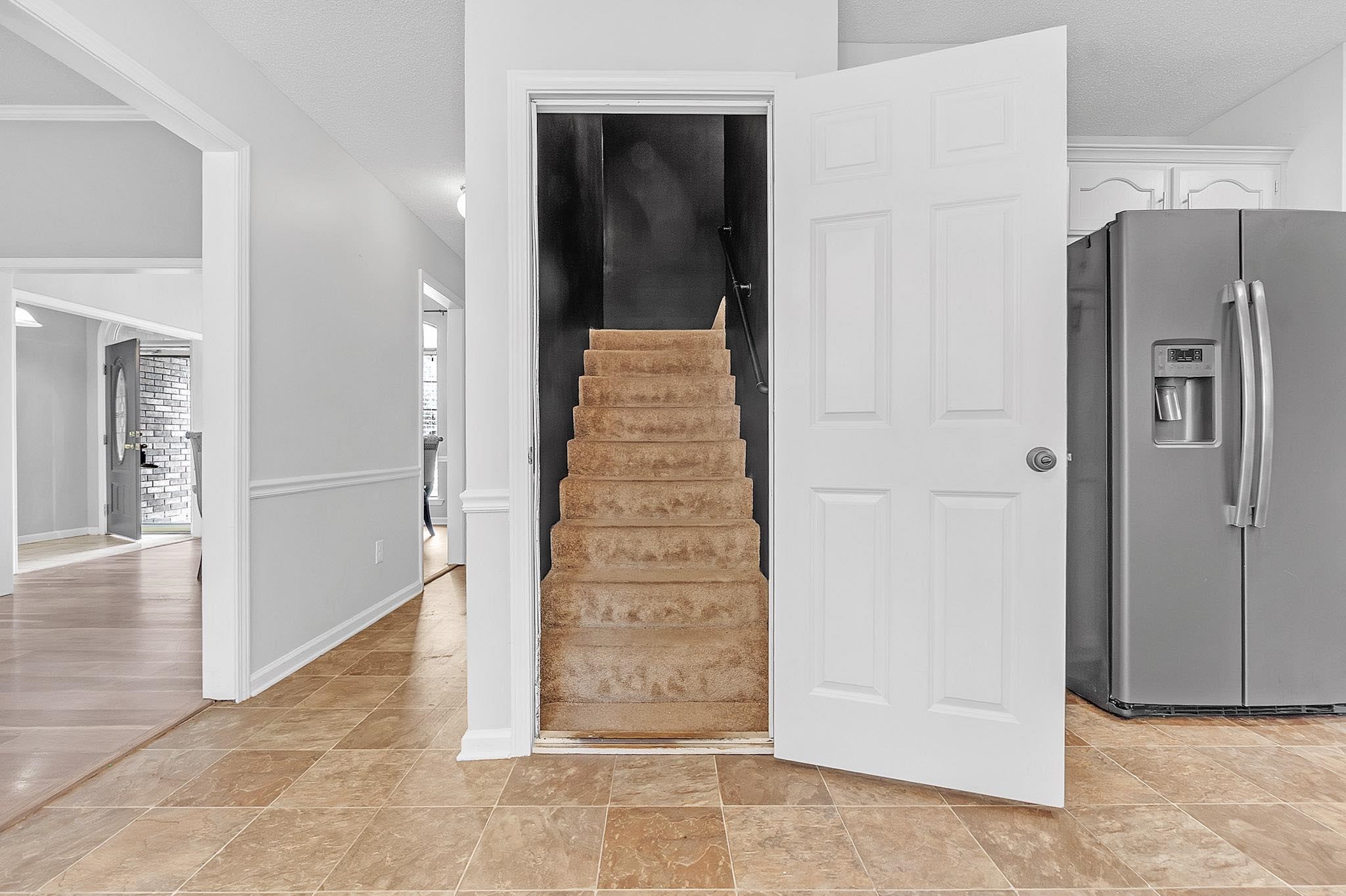 4788 Shadow View Lane Bartlett, TN 38002 - Photo 19 of 33 Stairs with stone finish floors and baseboards